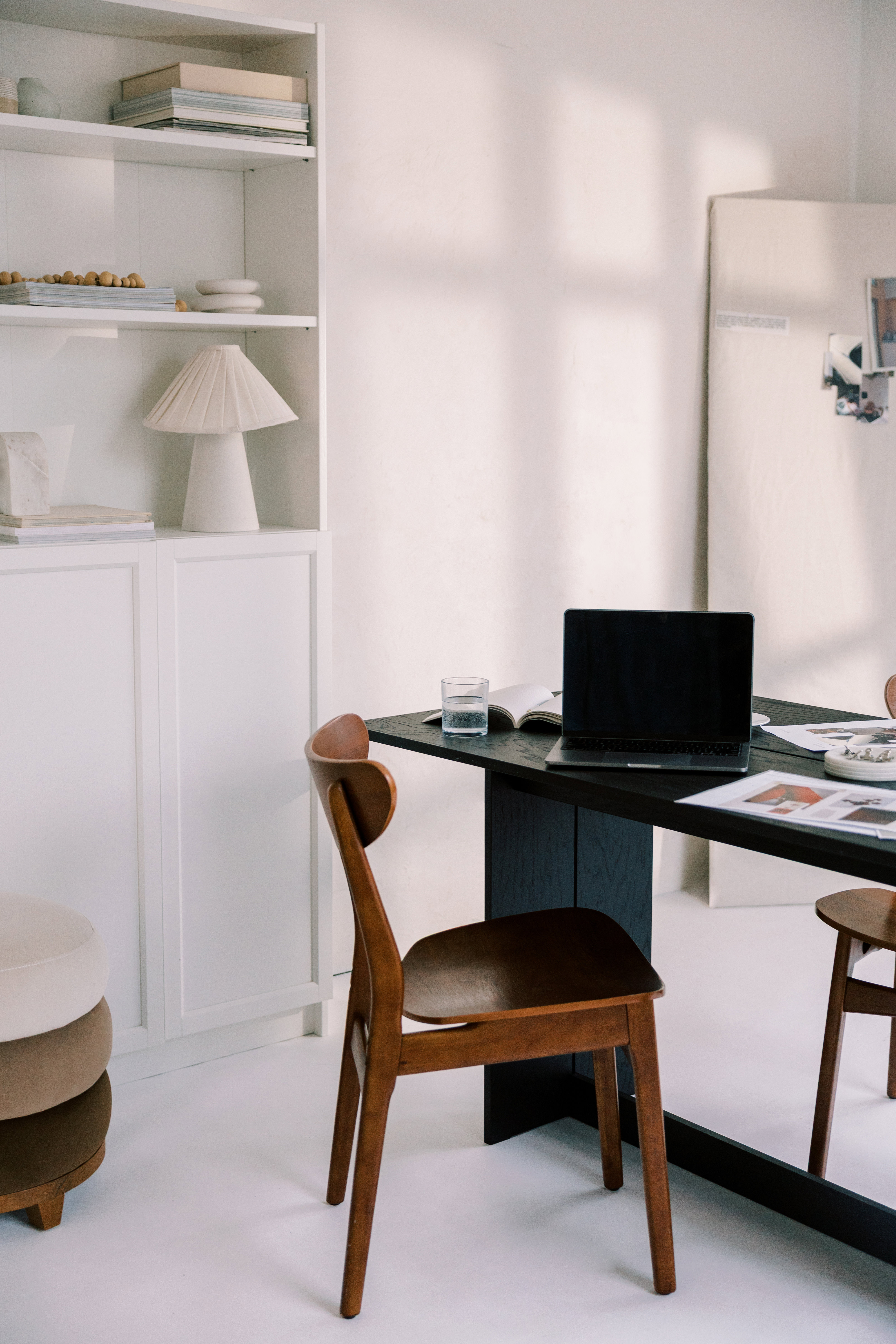 A quiet studio desk with a laptop